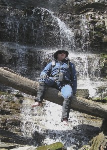 Wolfmaan barefoot at waterfall